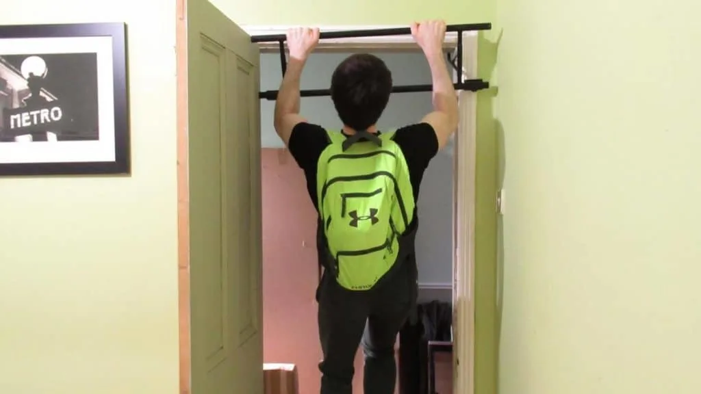 A man showing how pull ups can work your forearms