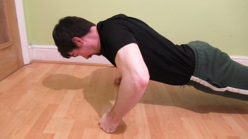 A man showing how pushups work your forearm muscles
