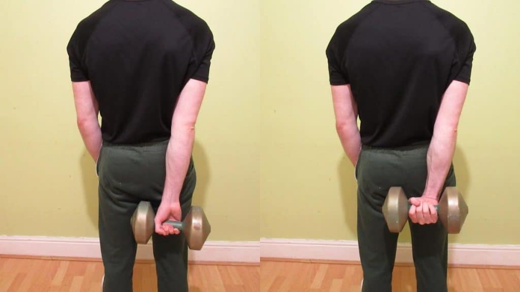 A man performing a dumbbell behind the back wrist curl
