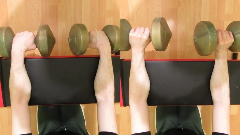 A man performing a dumbbell reverse grip wrist curl