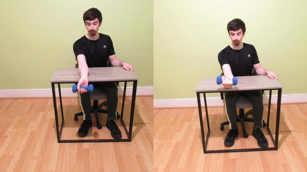 A man doing a dumbbell wrist flexion over a table