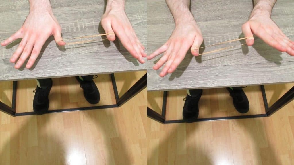 A man doing an exercise for the flexor pollicis longus