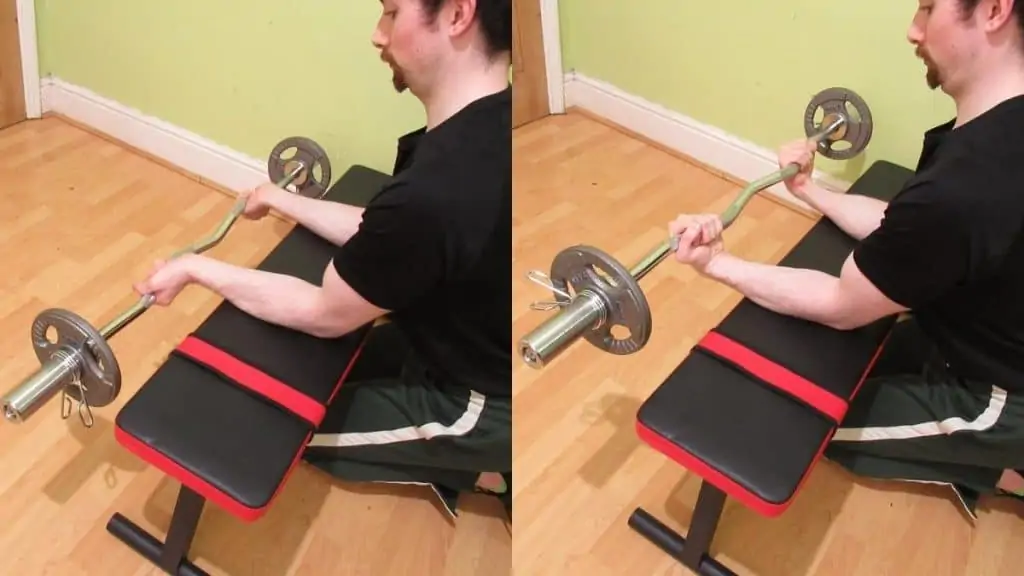 A man performing an EZ bar forearm curl