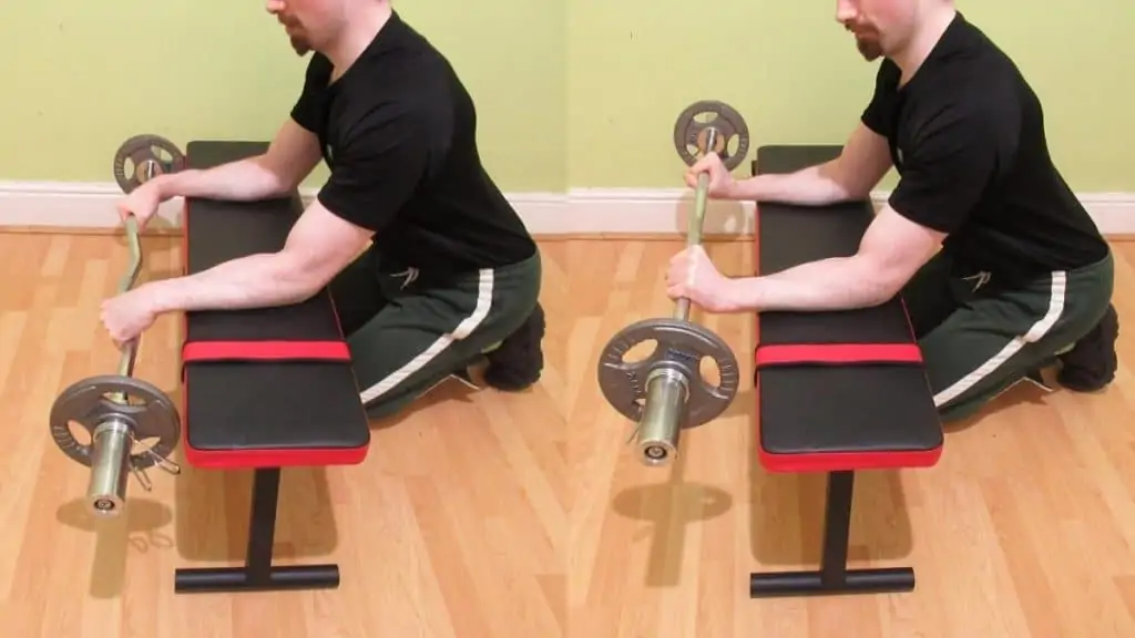 A weight lifter doing an EZ bar reverse wrist curl