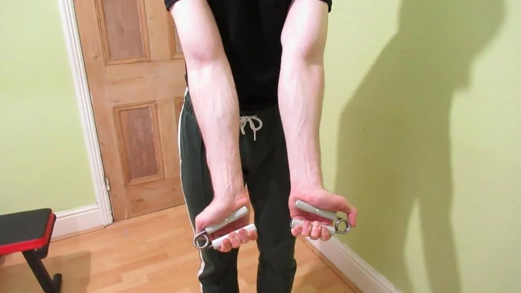 A man performing some flexor digitorum profundus exercises