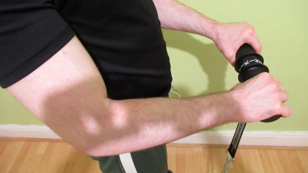 A man using a forearm blaster device
