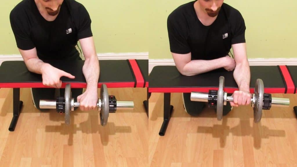 A man showing that forearm curls can be bad if you lift too much weight