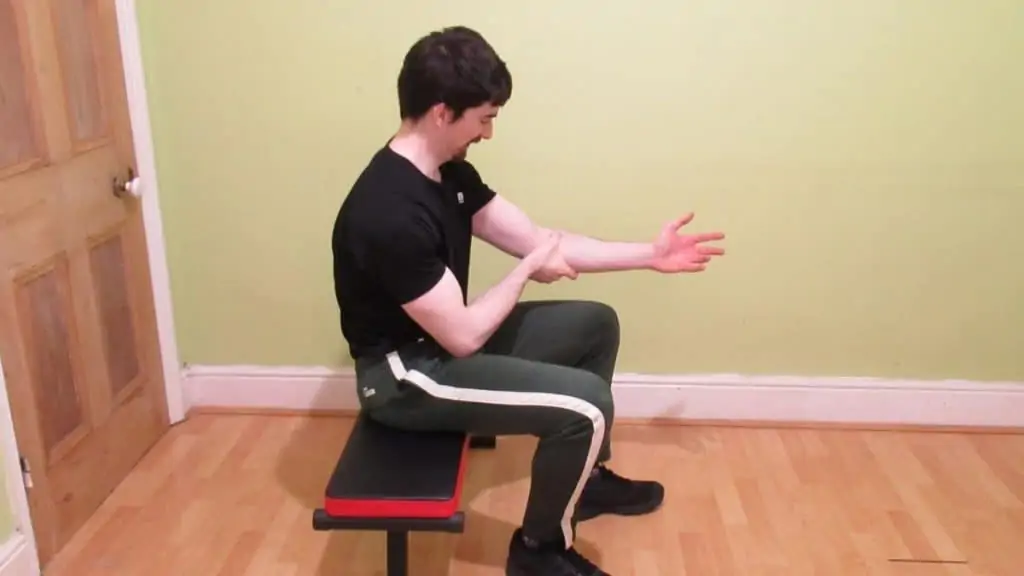 A man with a forearm flexor strain