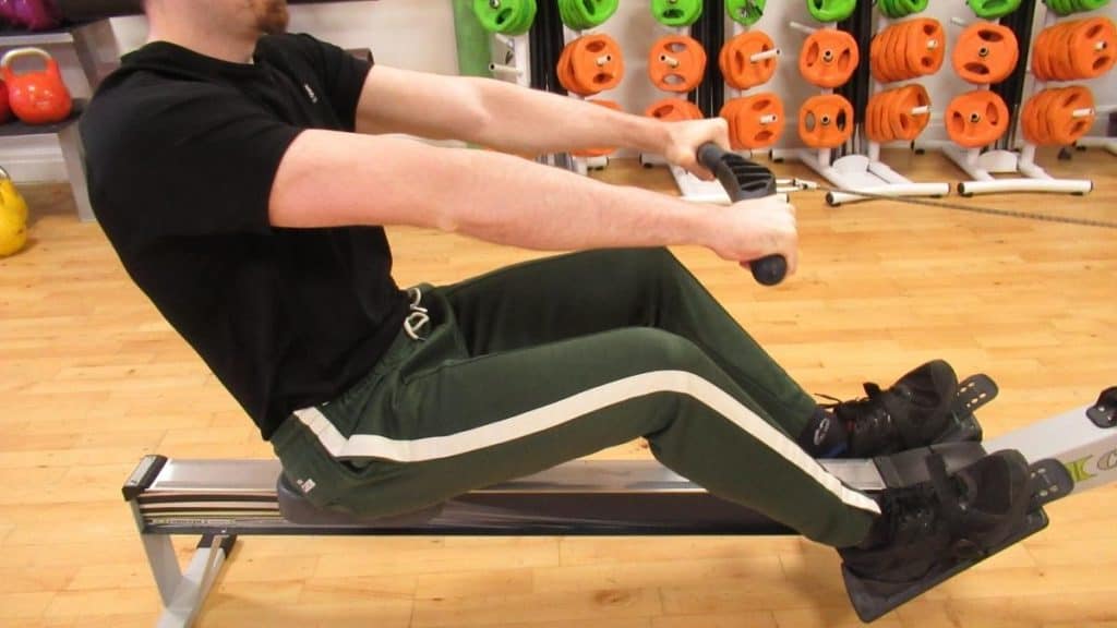 A man showing how rowing can hurt your forearms