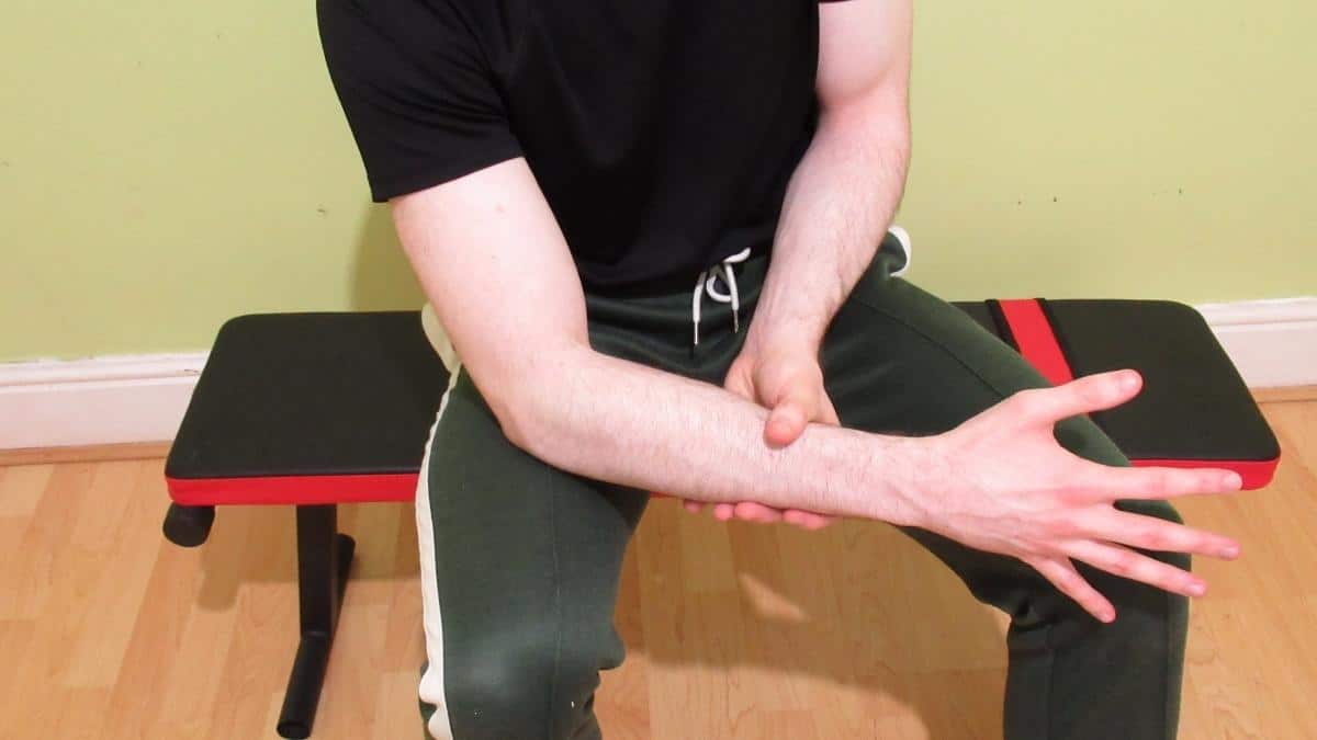 A man with a painful forearm muscle strain