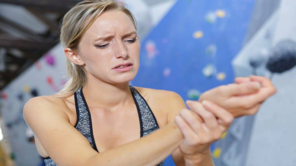 A woman with forearm pain from rock climbing