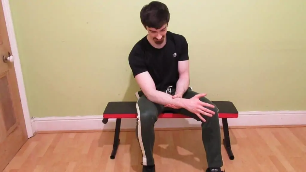 A man with forearm pain from lifting weights