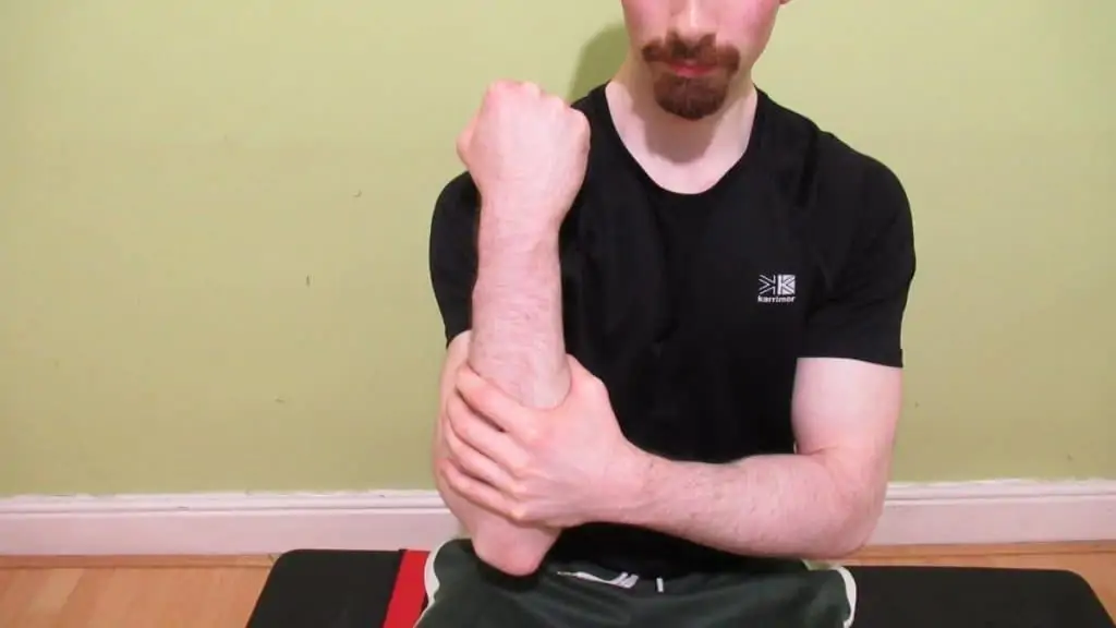 A man who experiences forearm pain when lifting heavy and light objects