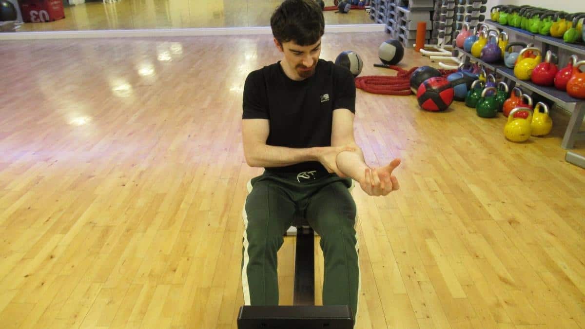 A man with forearm pain due to rowing