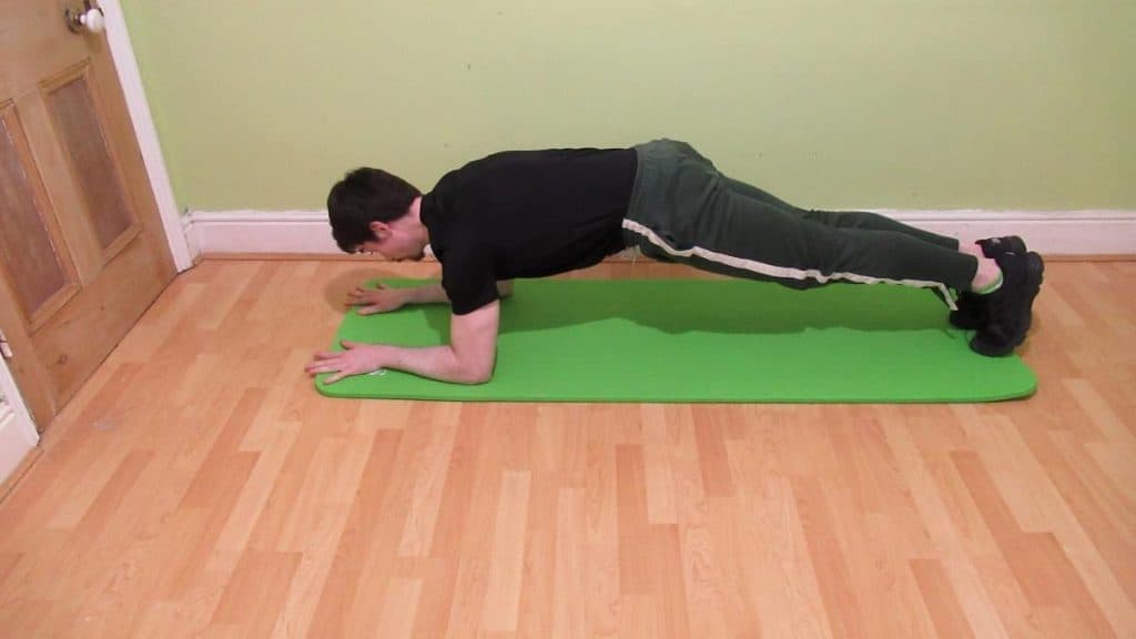 A man doing a forearm plank