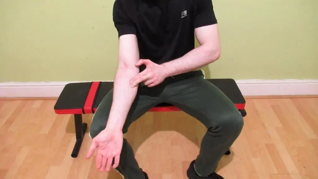 A man performing some forearm self massage