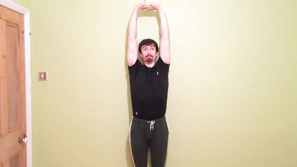 A man performing a forearm stretch