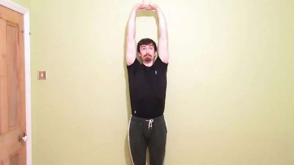 A man performing a forearm stretch