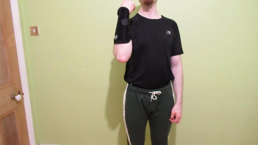 A man wearing a forearm tendonitis brace to support his lower arm