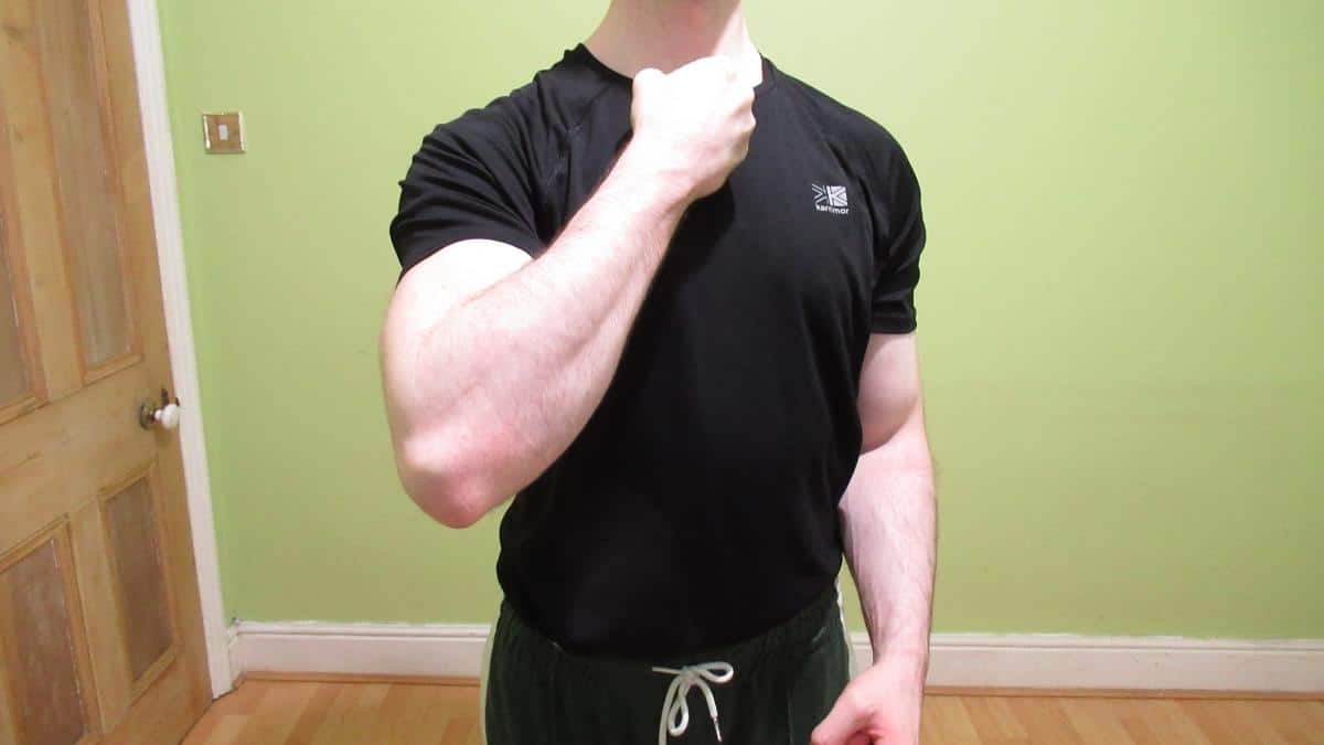 A man showing off his impressive forearm transformation