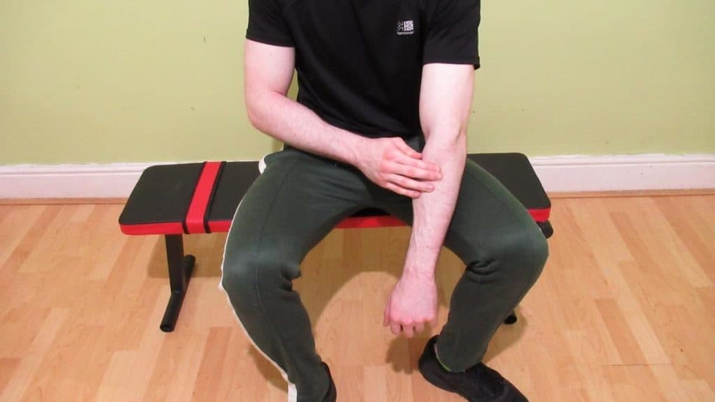 A man highlighting some common forearm trigger points
