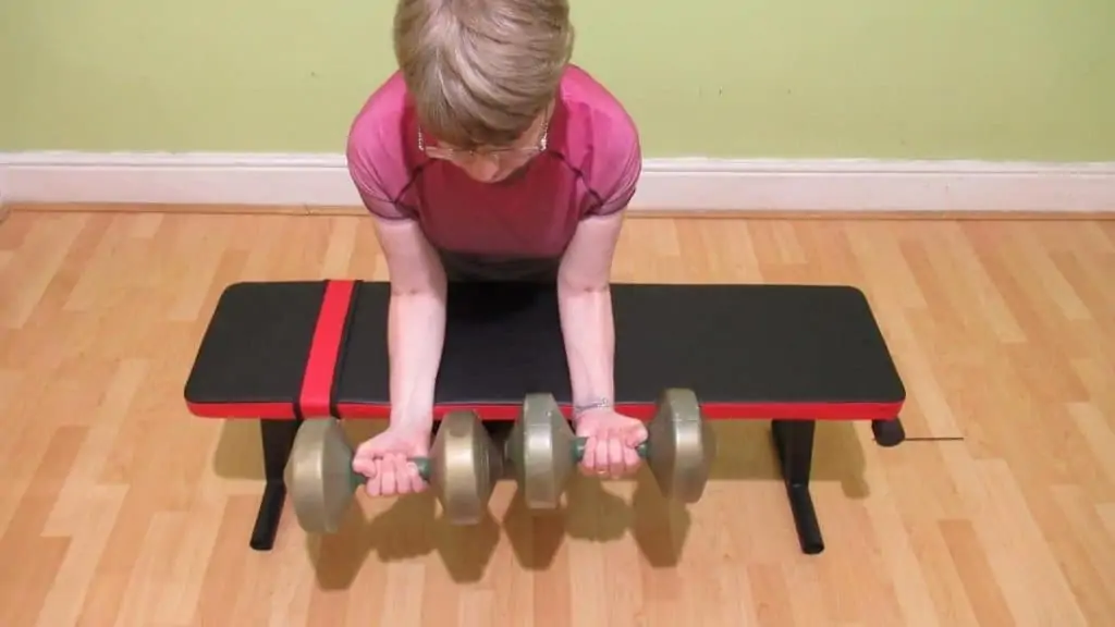 A woman doing a forearm workout