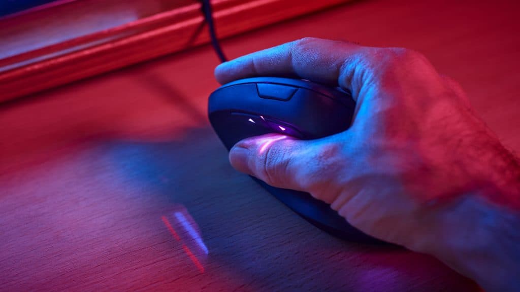 A hand on a gaming mouse
