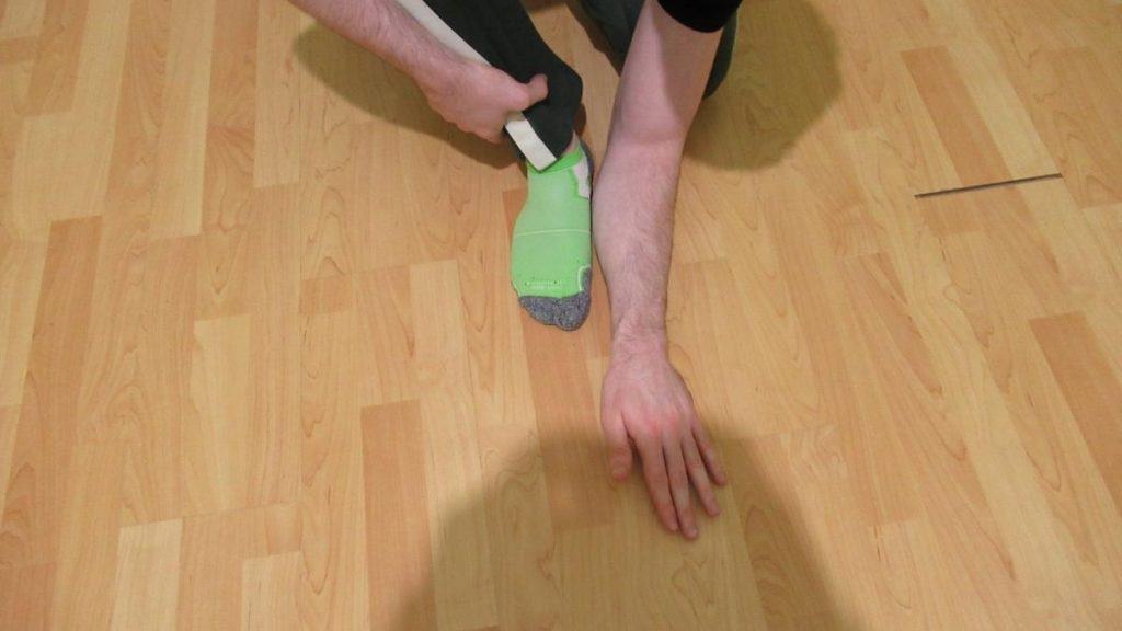 A man showing that your forearm is roughly the size of your foot