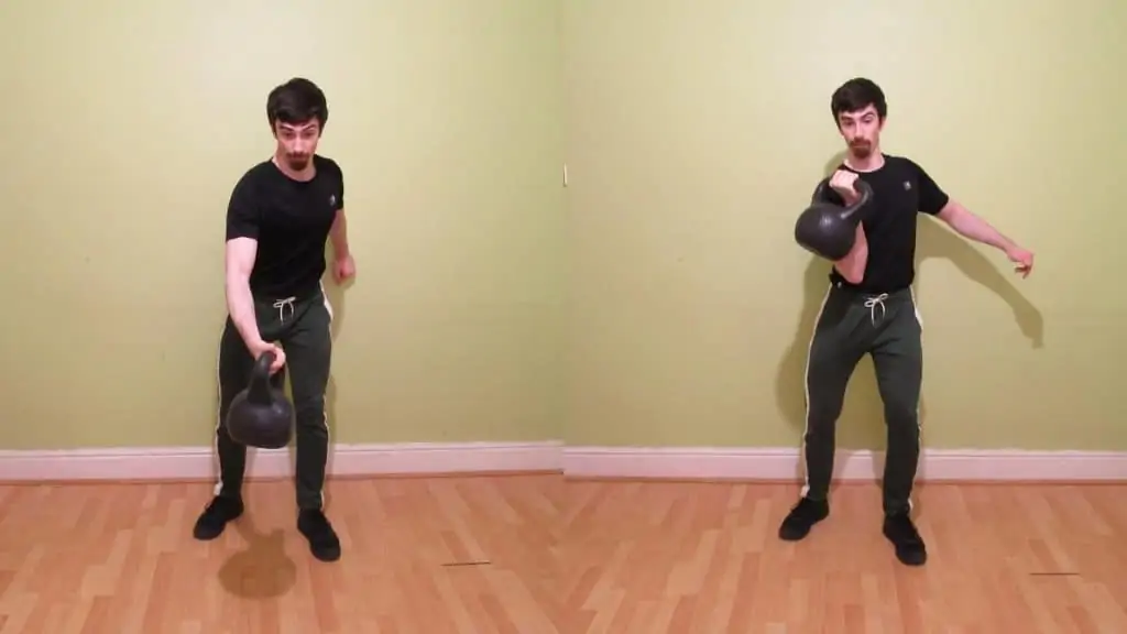 A kettlebell hitting a man's forearm as he swings it up