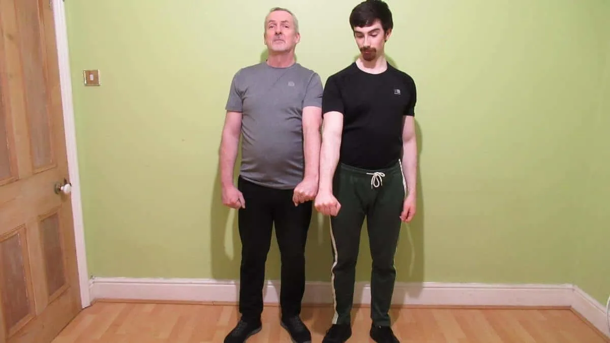 Two men showing their long forearms