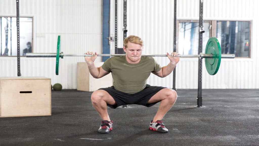 A man performing a squat