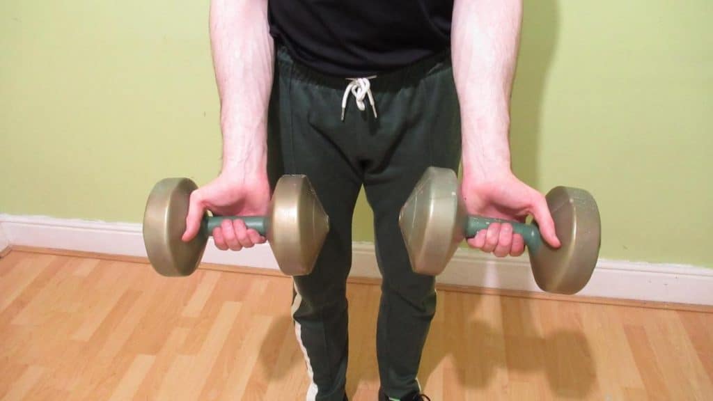 A man holding some dumbbells