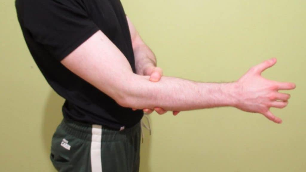 A man holding his forearm