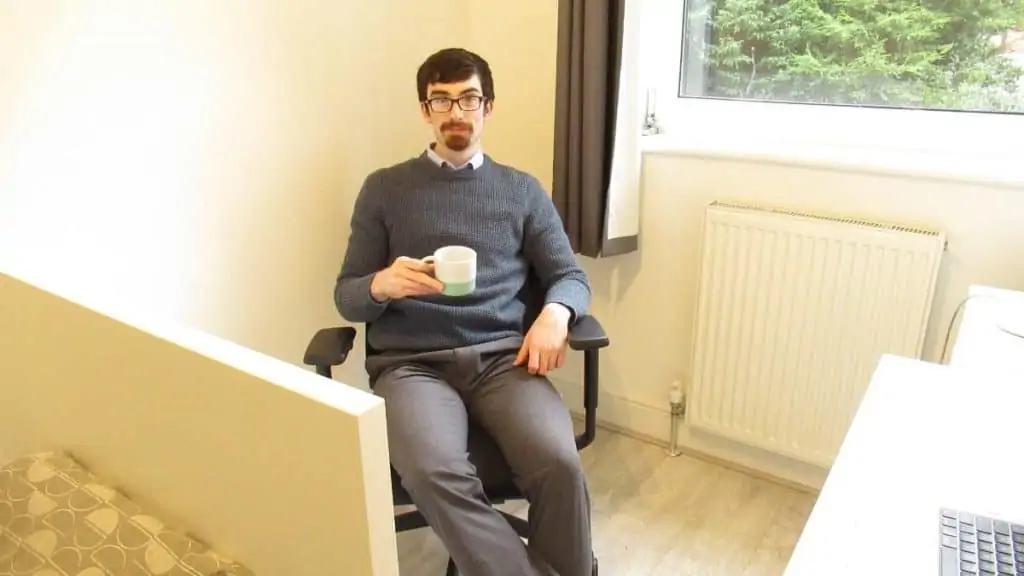 A man sat in an office chair