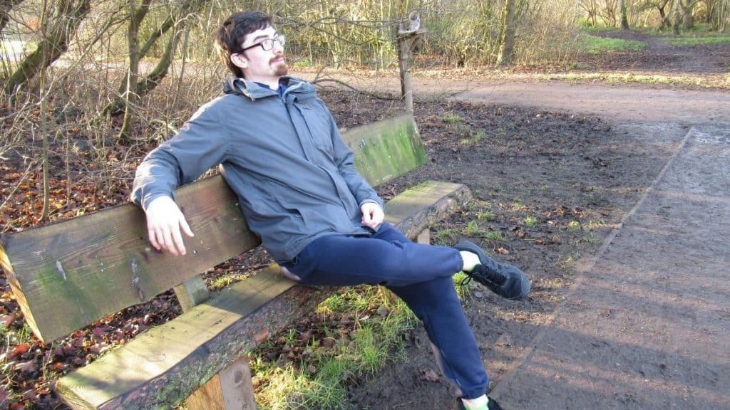 A man sat on a park bench