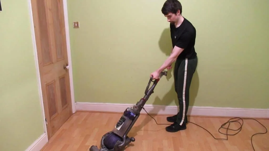 A man using a vacuum cleaner