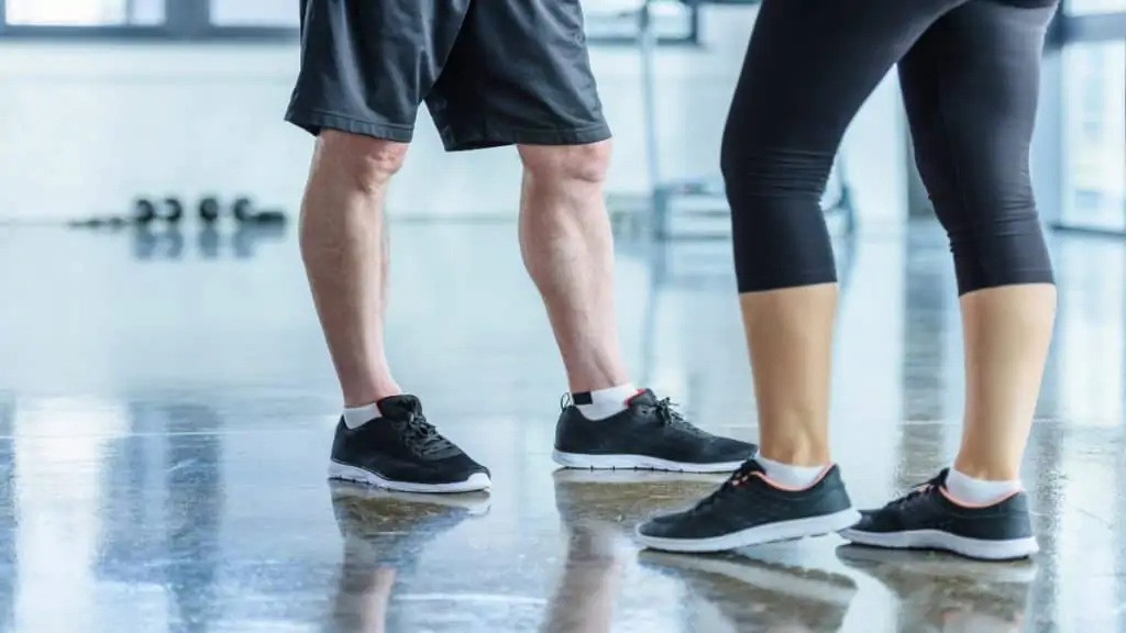 Close up of a man and a woman's calves