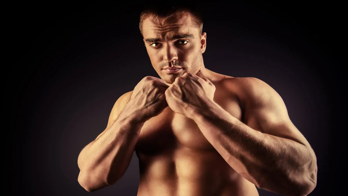 A martial artist showing his forearms to the camera