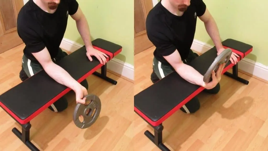 A man performing plate wrist curls for his forearms