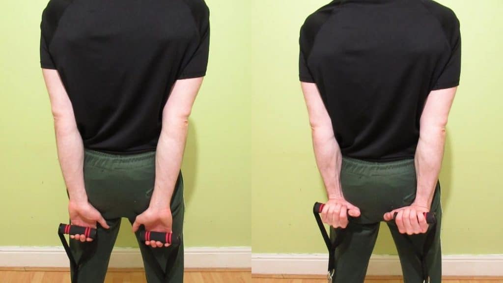 A man doing a resistance band behind the back wrist curl