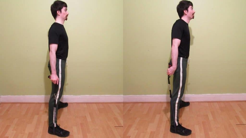 A man performing a resistance band rear rotation