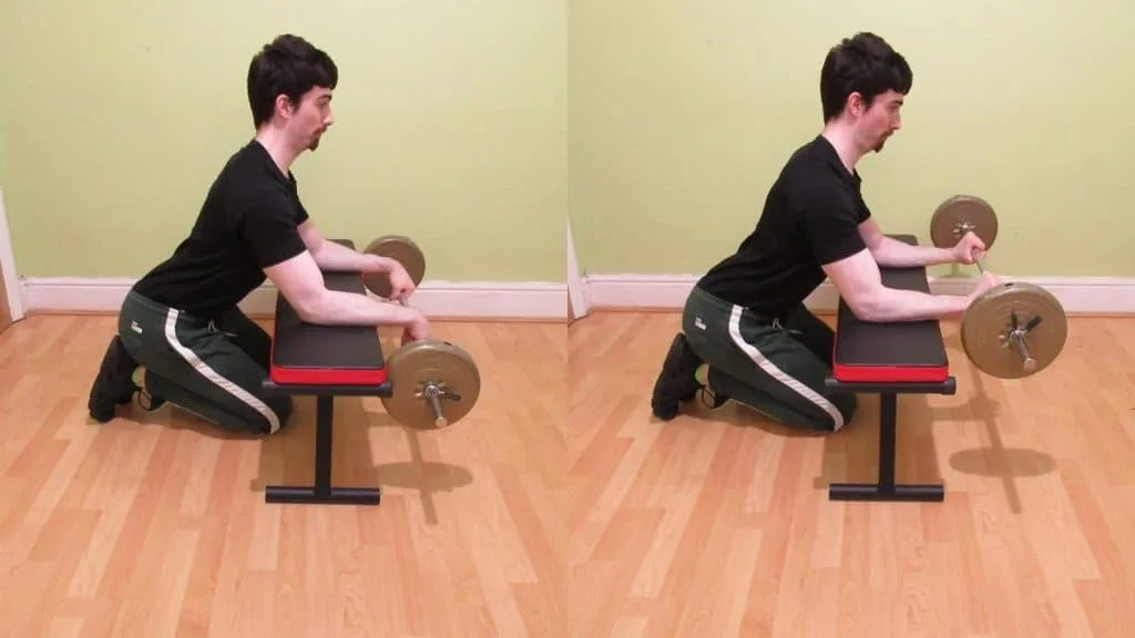 A weight lifter doing a reverse barbell forearm curl