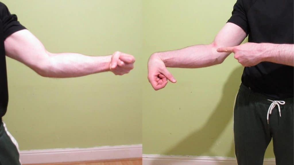 A man showing that his right forearm is bigger than his left forearm