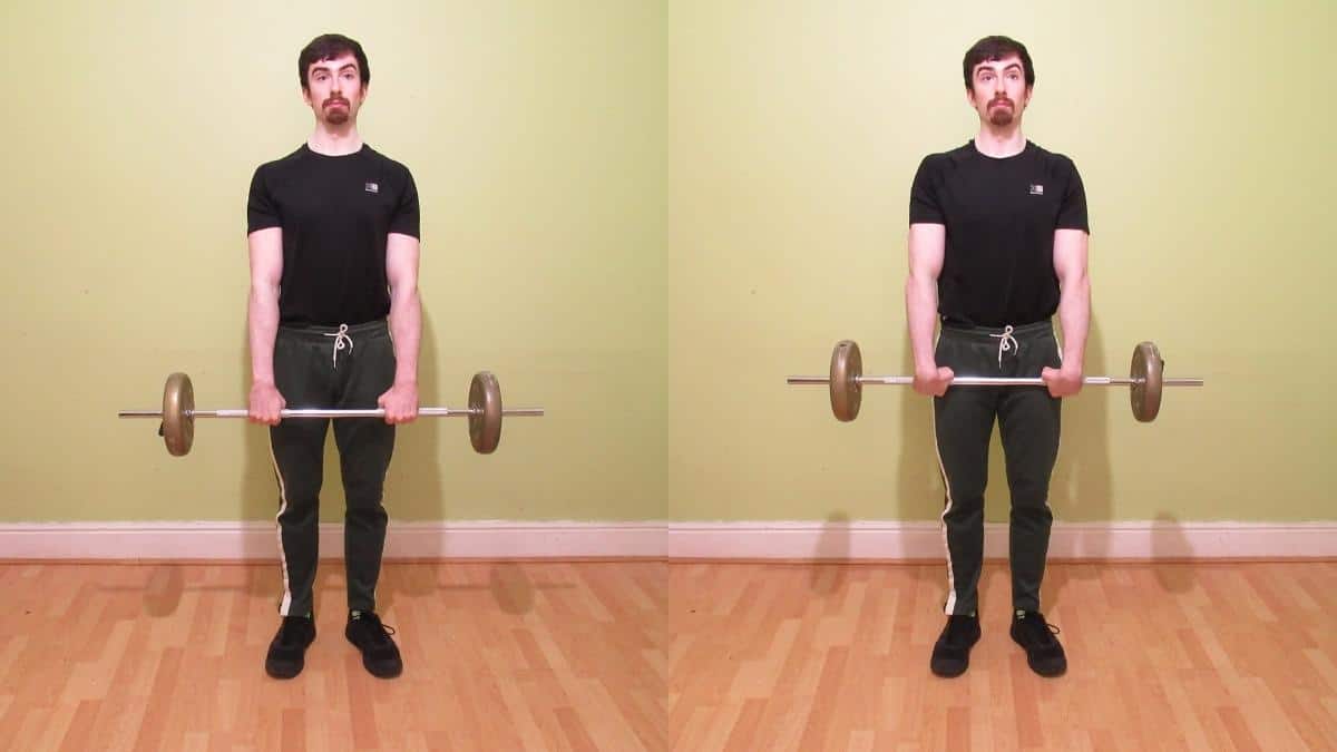 A weight lifter doing a standing wrist curl to work his forearms