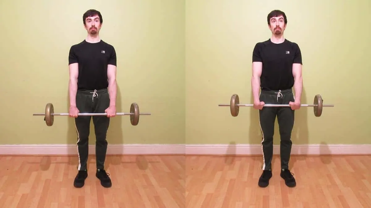 A weight lifter doing a standing wrist curl to work his forearms