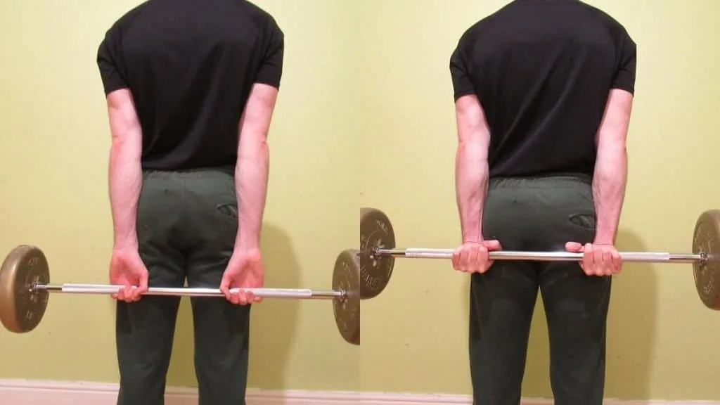 A man lifting some weight during the standing wrist curl