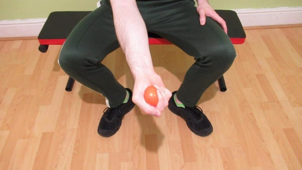 A man doing a stress ball squeeze