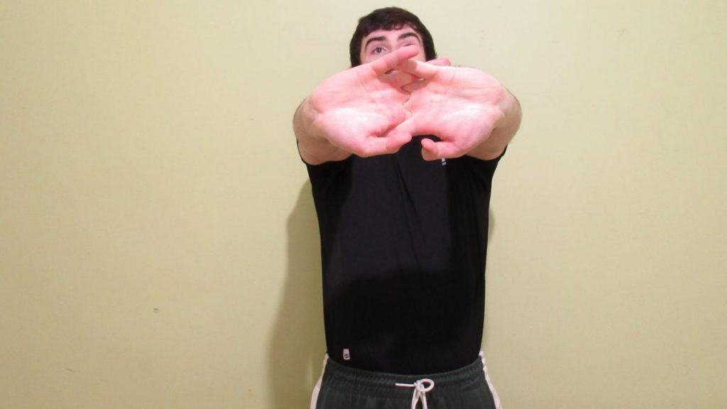 A man demonstrating some stretches for your forearms