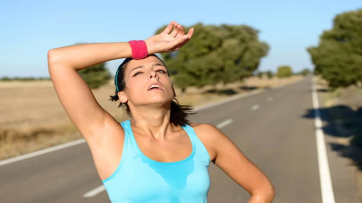 A runner with sweaty forearms