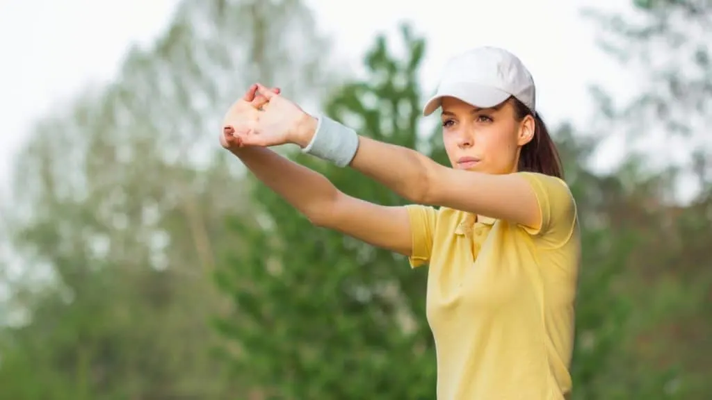 A female tennis player stretching